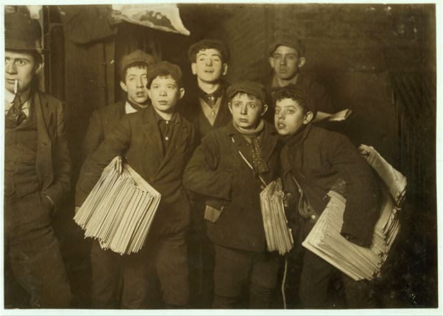 Newsboys selling papers